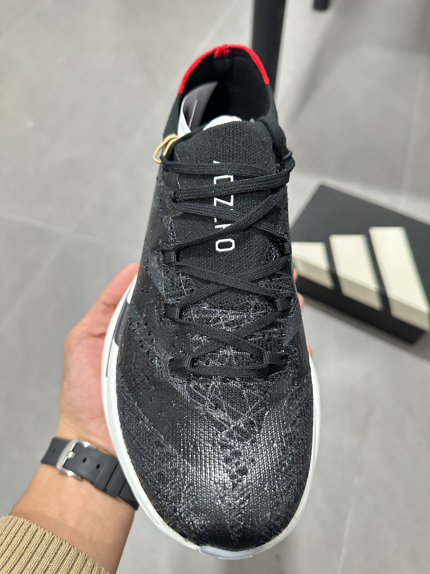Adidas ADIZERO ADIOS PRO 4 (Core Black / Cloud White / Solar Red colorway)