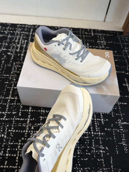 On Cloudmonster Unisex Road Running Sneakers Cream Off White Gold Band Beige Midsole Thick CloudTec Sport Shoes