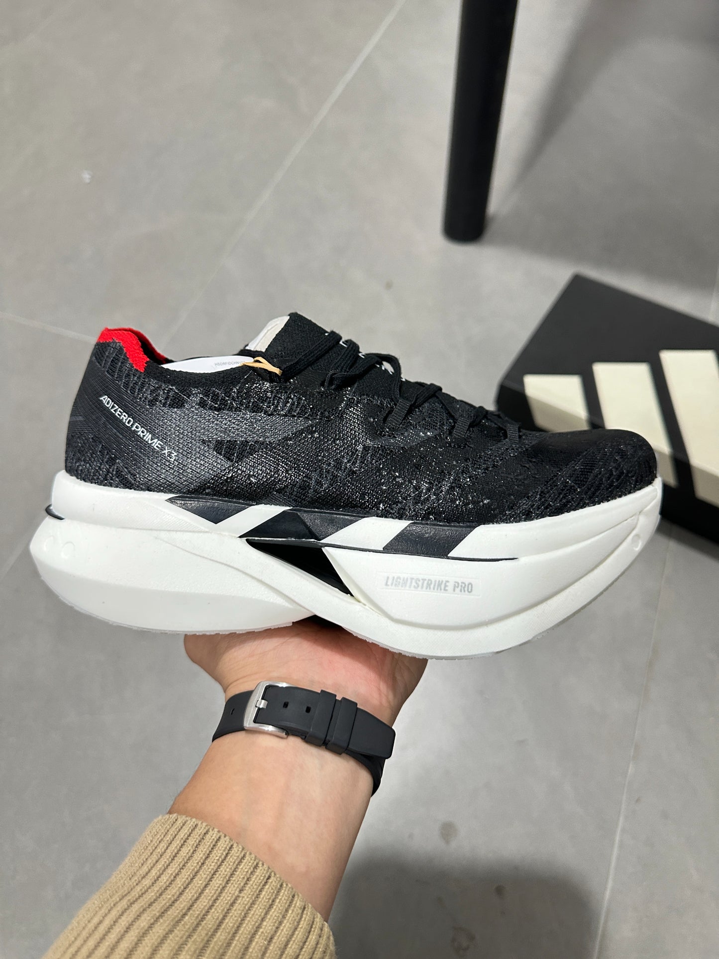 Adidas ADIZERO ADIOS PRO 4 (Core Black / Cloud White / Solar Red colorway)