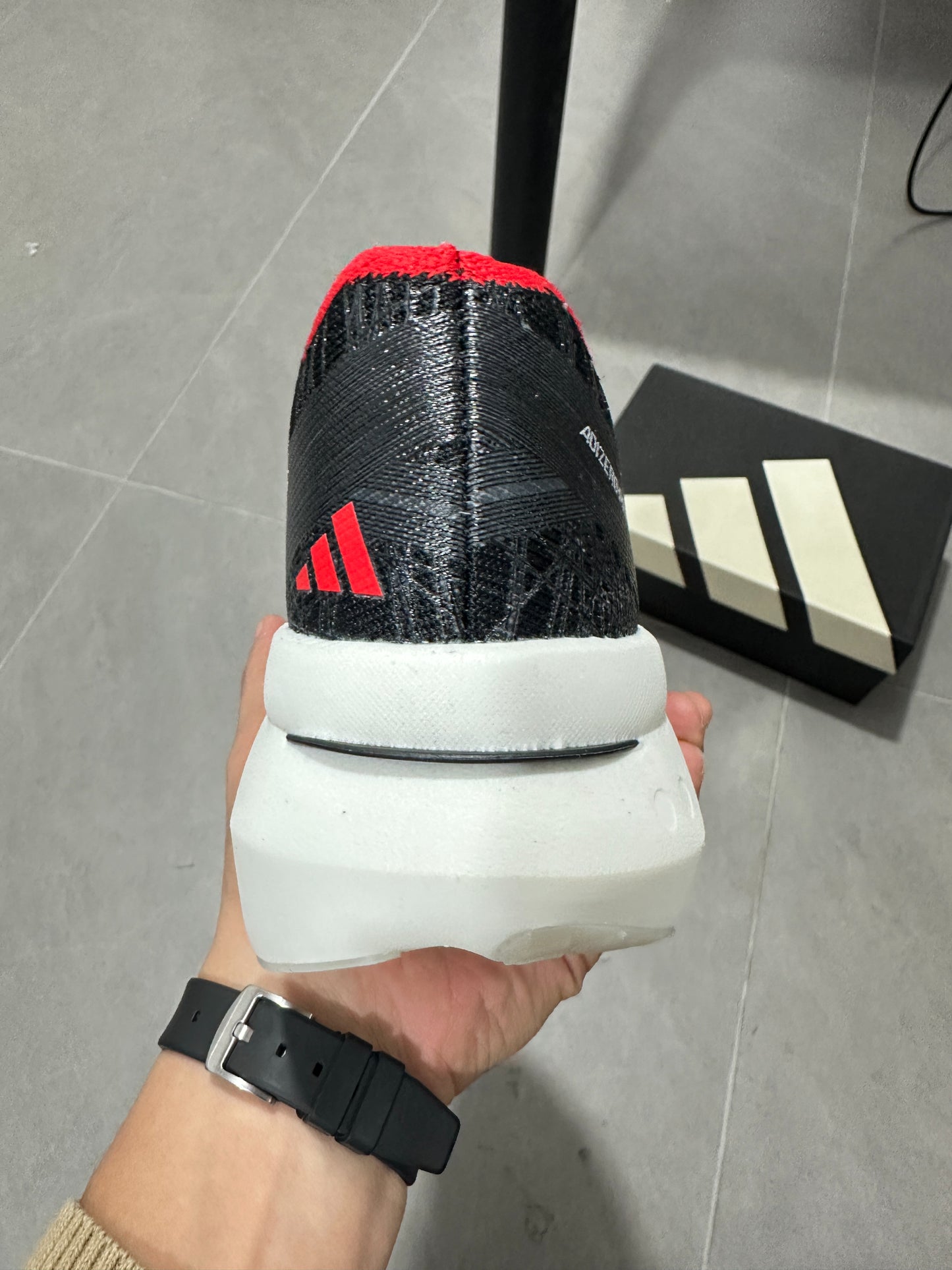 Adidas ADIZERO ADIOS PRO 4 (Core Black / Cloud White / Solar Red colorway)