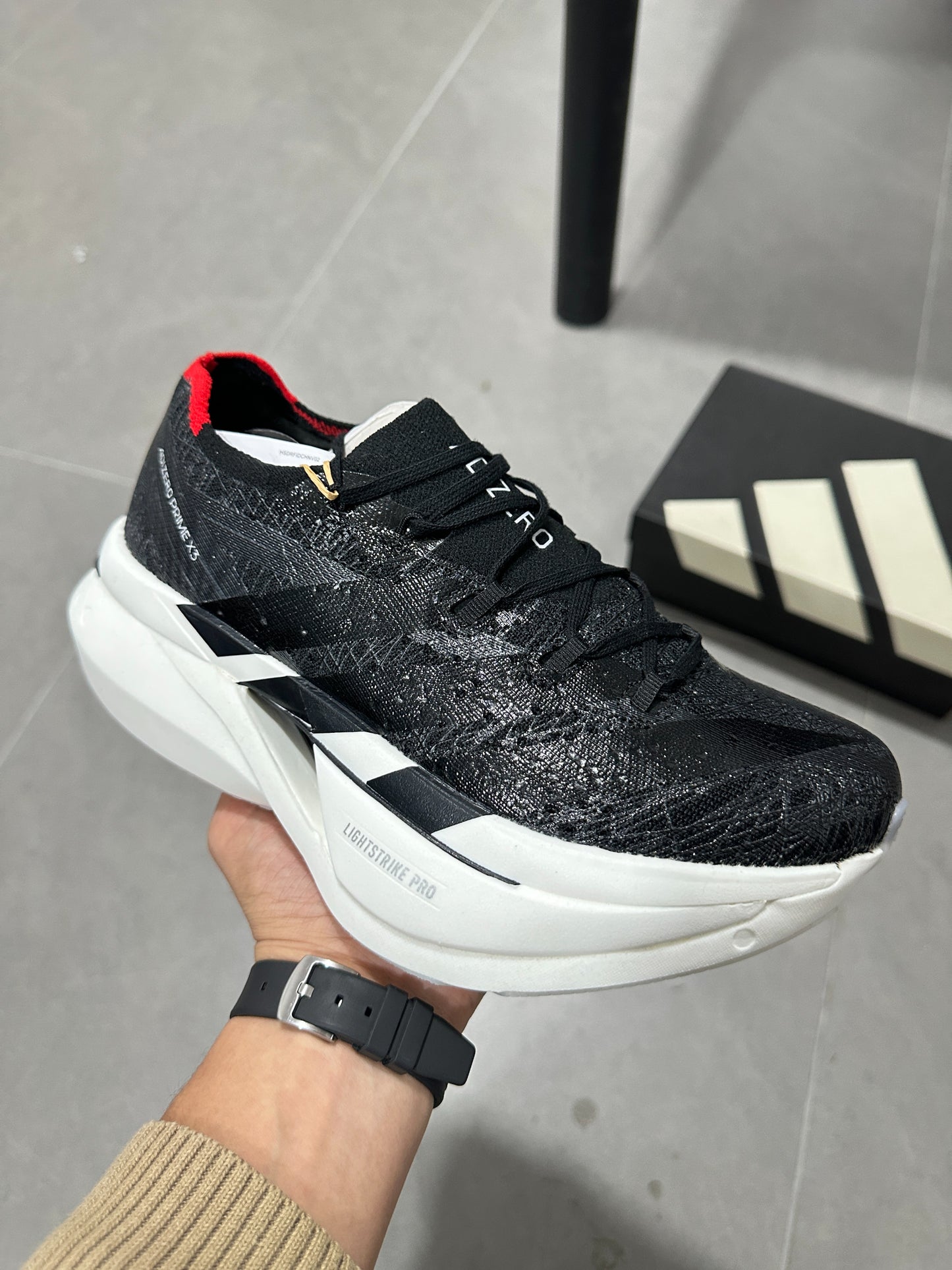 Adidas ADIZERO ADIOS PRO 4 (Core Black / Cloud White / Solar Red colorway)