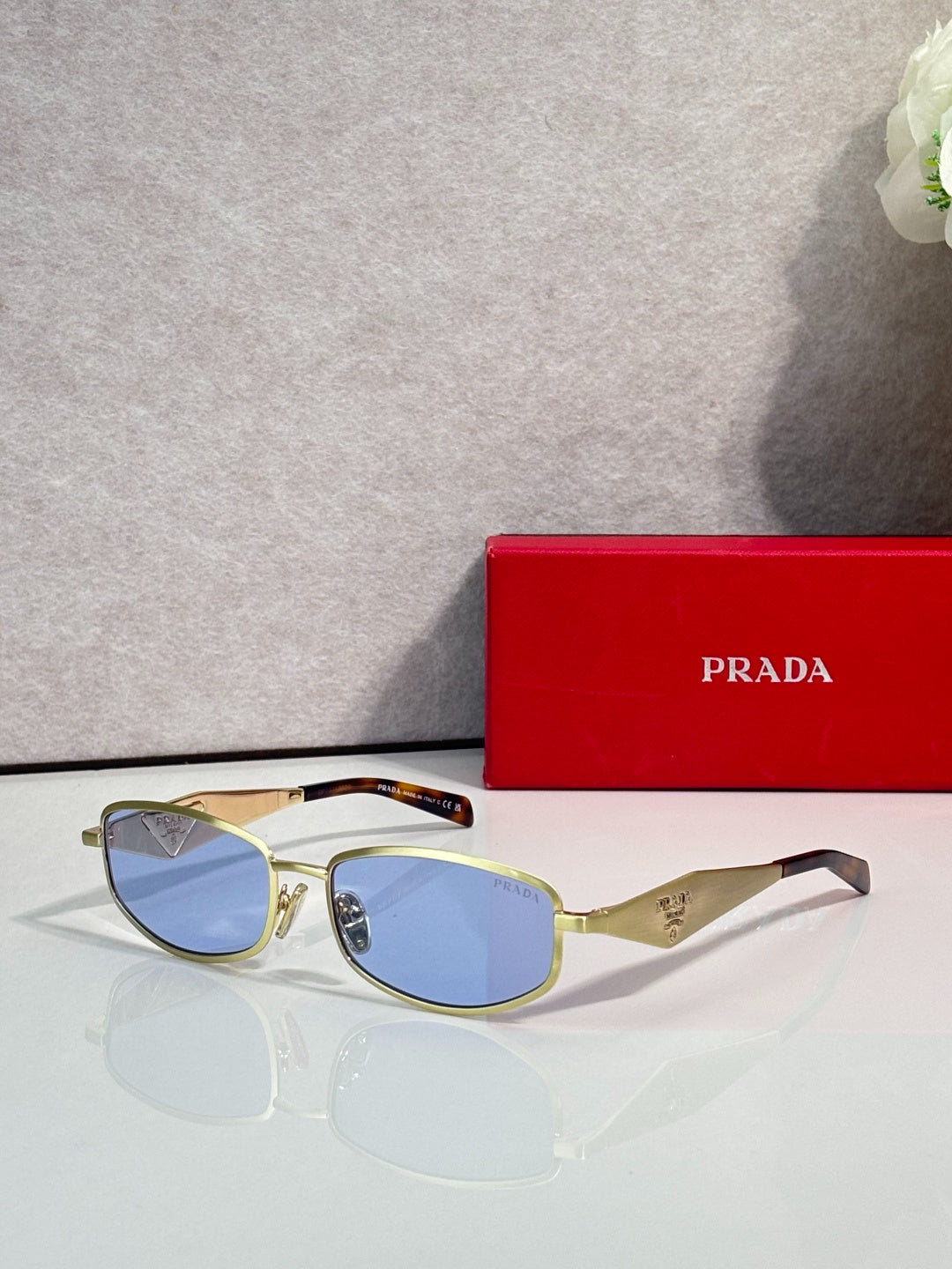 Prada Gold-Tone Metal Rectangular Sunglasses with Light Blue Lenses
