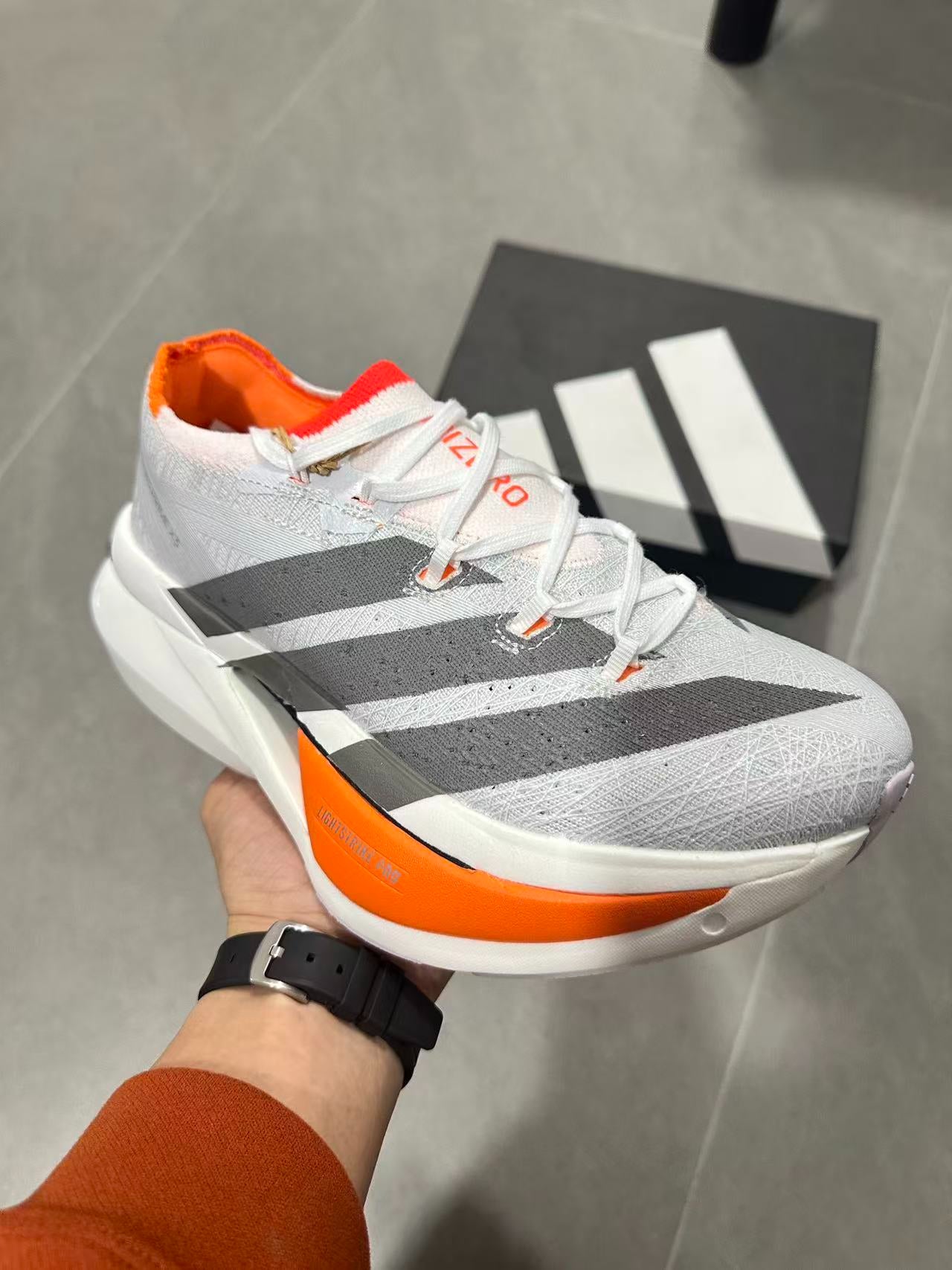 Adidas ADIZERO PRIME X3 STRUNG (Cloud White / Grey / Solar Red colorway)