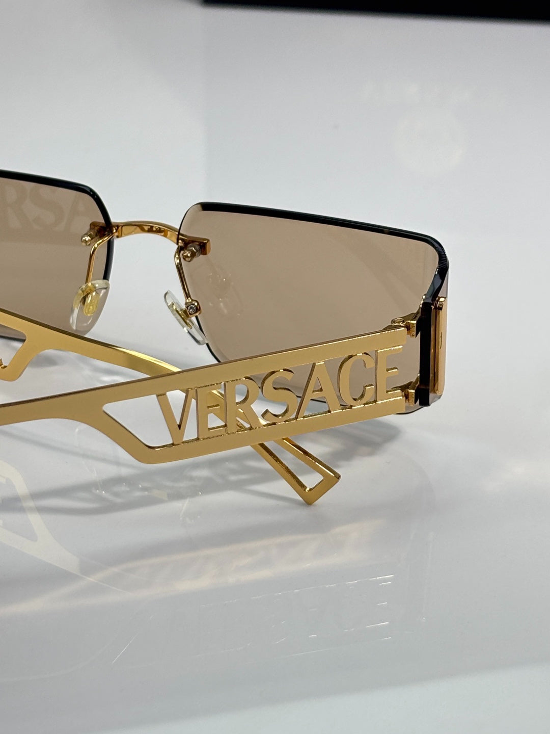 Versace Gold-Tone Rimless Sunglasses with Light Brown Lenses & Medusa Logo Temples