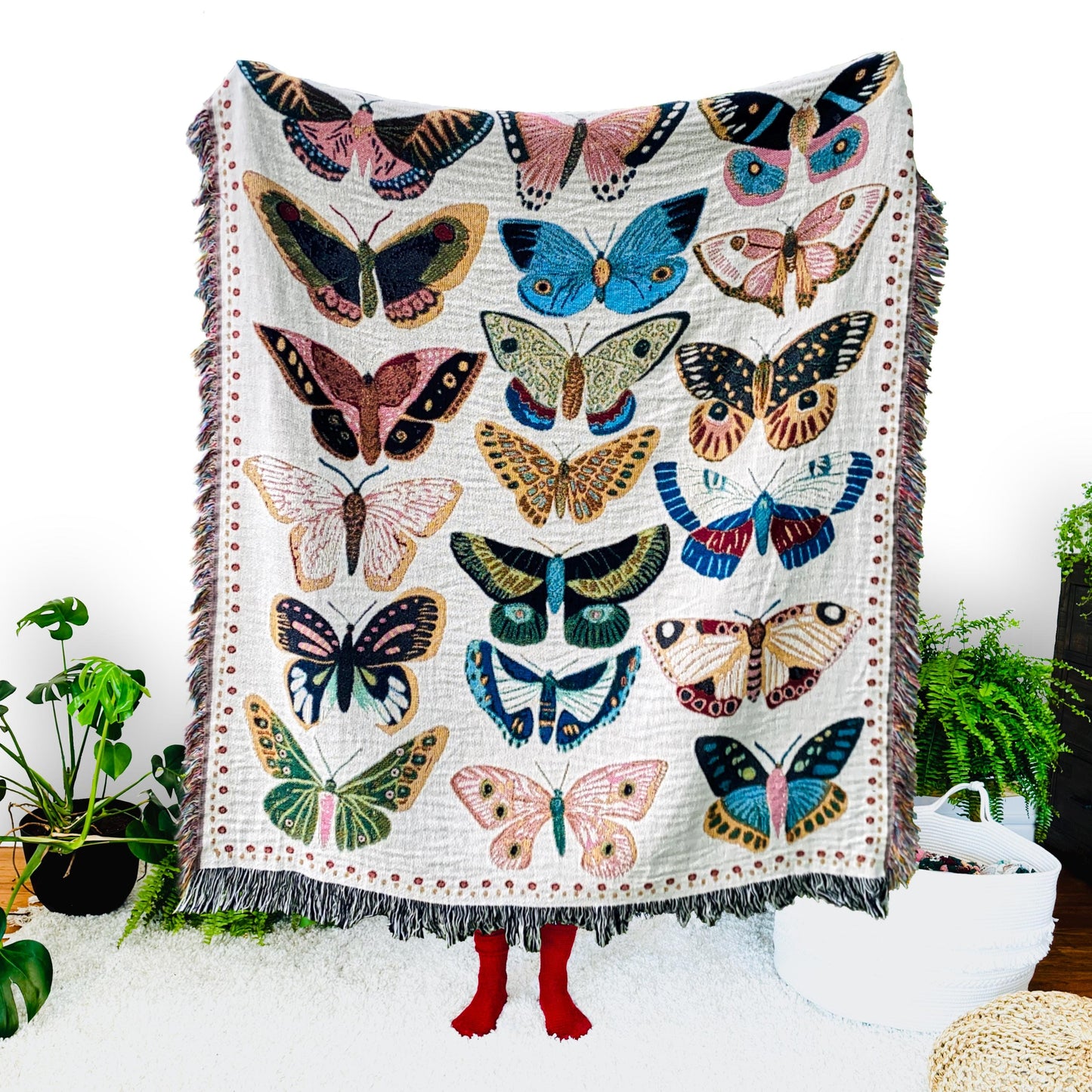 Cozy woven throw blanket with vibrant hand-illustrated butterflies. Brings joyful colors and charm to nurseries, dorms, and reading nooks.